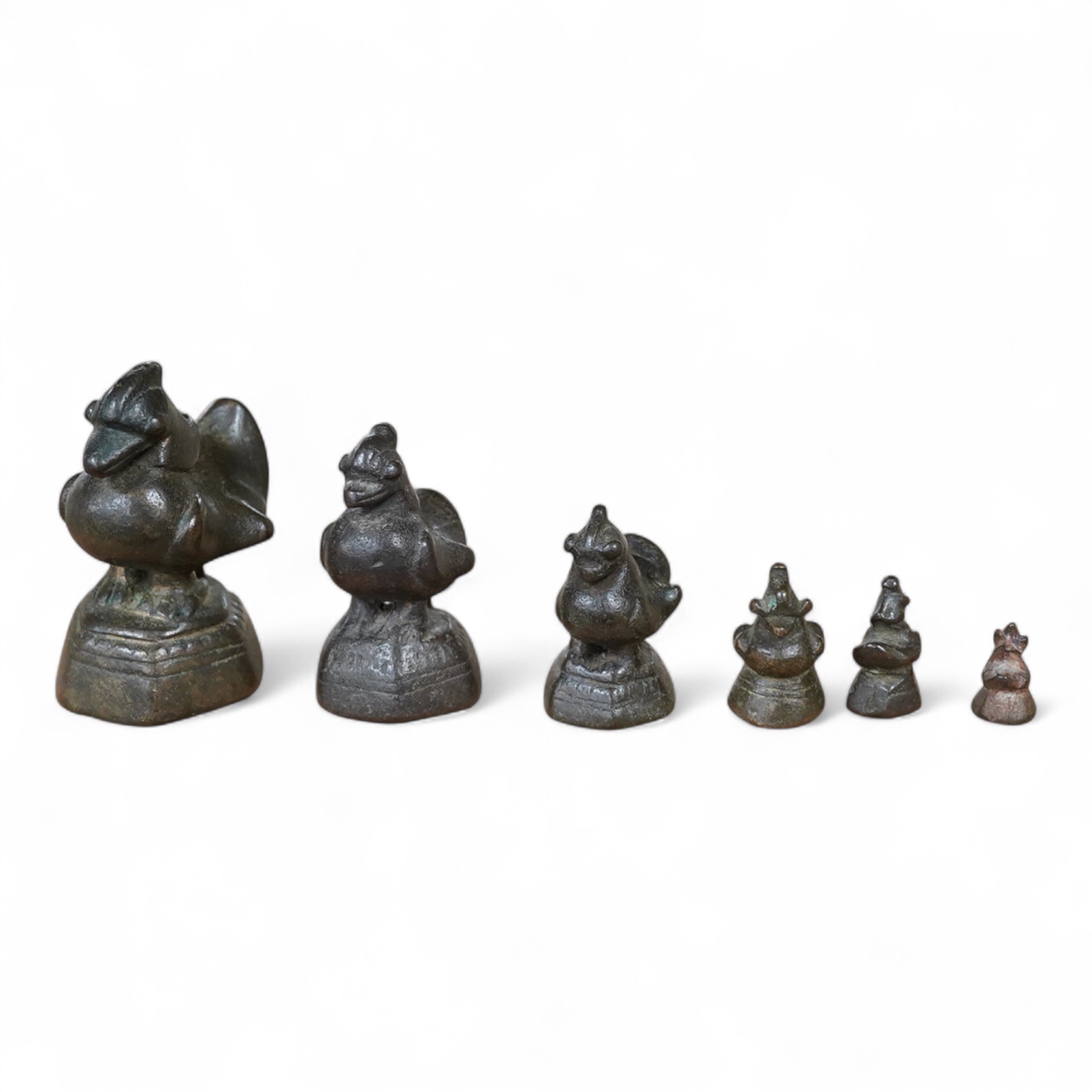 A graduated set of six Burmese bird opium weights, 7cm high